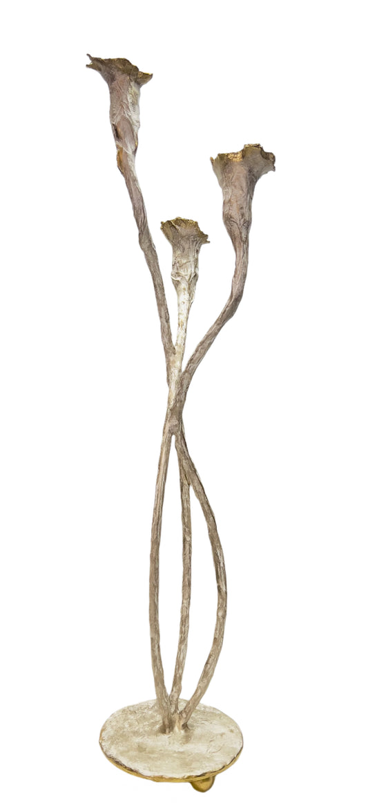 Decorative candle holder with three curved branches on a white background